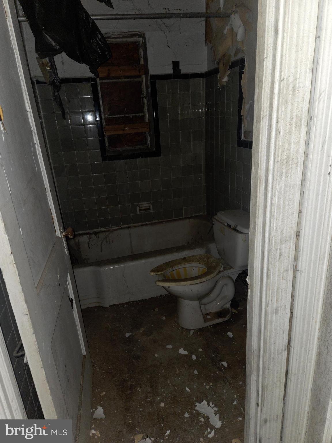 4639 Hillside Road Southeast Washington, DC 20019 - Photo 10 of 23 a bathroom with a toilet and a shower