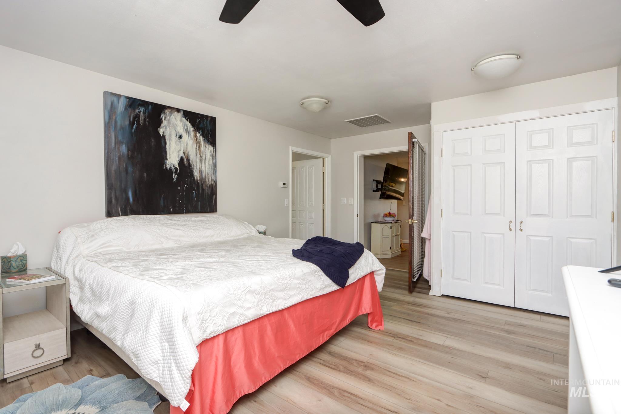 2528 Waterwheel Road Emmett, ID 83617 - Photo 35 of 50 Interior space featuring light wood paneling, wood-finish flooring, and a white wall