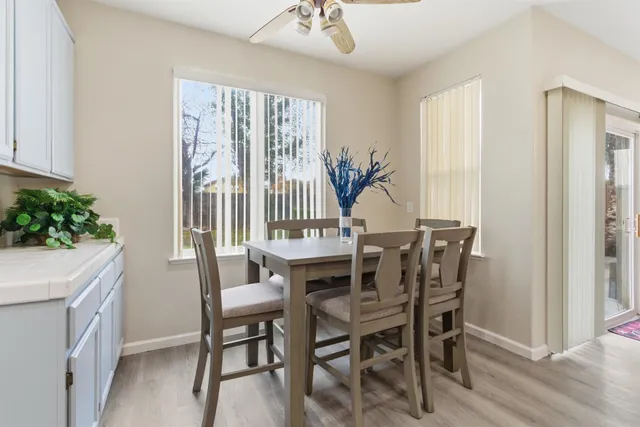 a view of a dining room with furniture and window