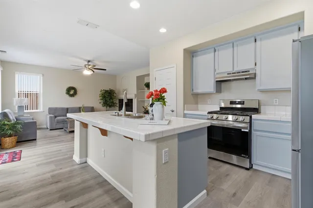 a kitchen with a sink and cabinets