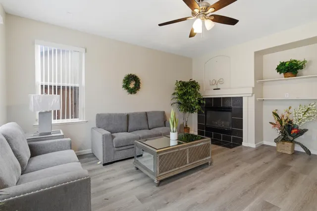 a living room with furniture and a fireplace