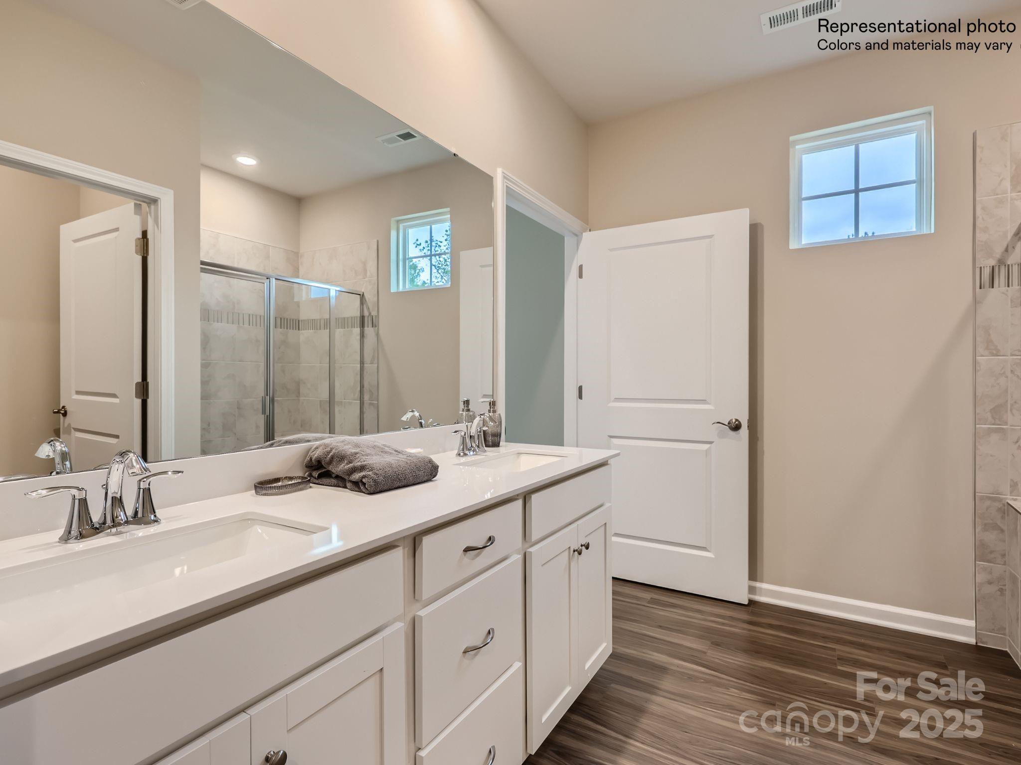 8441 Norman Frst Road Lancaster, SC 29720 - Photo 11 of 20 a bathroom with a granite countertop sink and a mirror