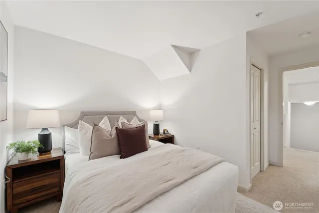 a bed room with a bed and a night stand