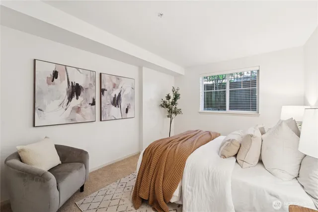 a bedroom with a bed and a couch