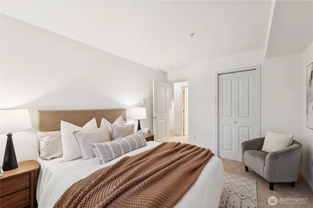 a bedroom with a bed and a couch