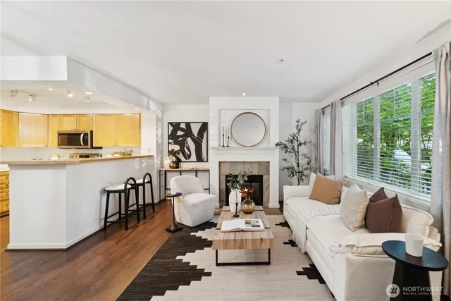 a living room with furniture fireplace and window