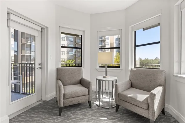 a large bed in a bedroom and a chandelier