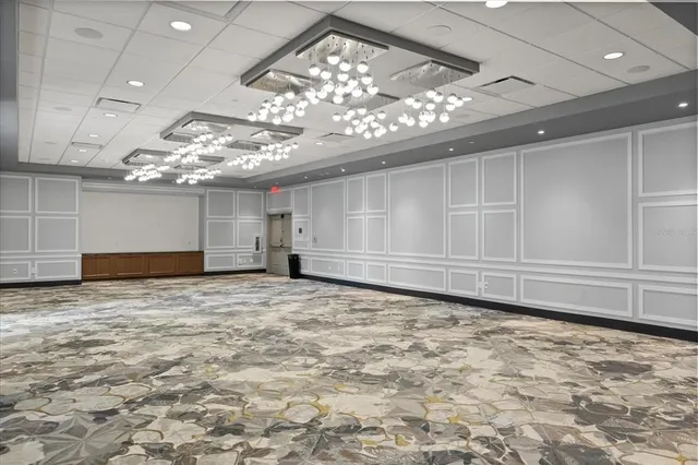 a view of living room with furniture and chandelier