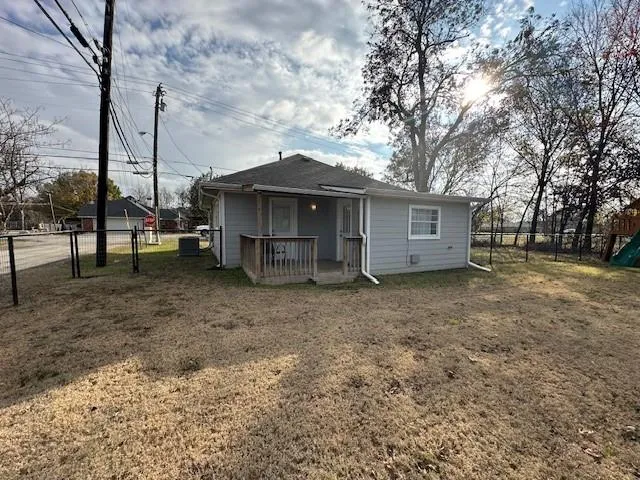 a view of a house with a yard and balcony