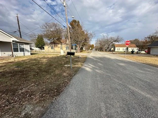 a view of road with houses