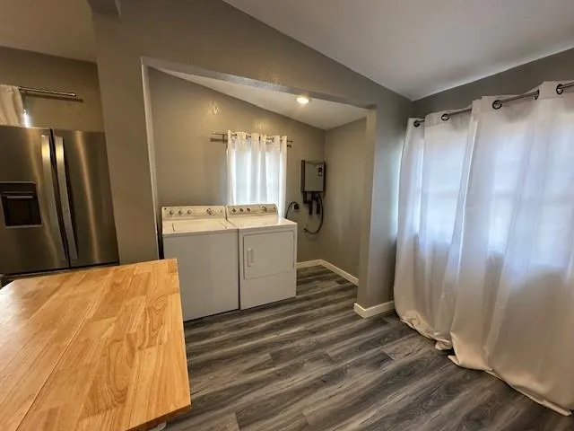 a view of kitchen with stainless steel appliances cabinets and wooden floor