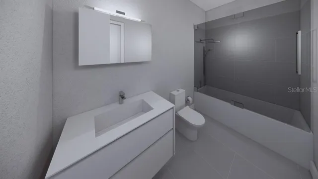 a bathroom with a toilet sink vanity and mirror