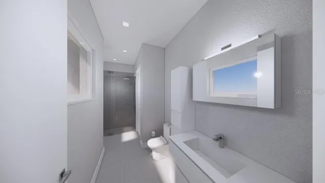 a bathroom with a tub sink and mirror
