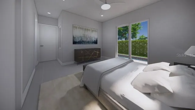 a bedroom with a bed and a large window