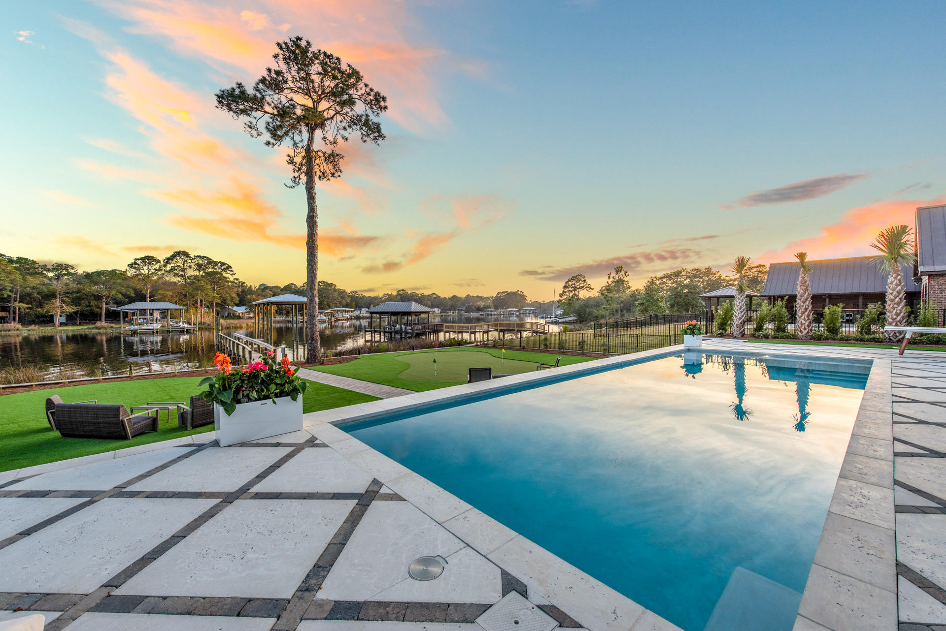 336 East Shipwreck Road Santa Rosa Beach, FL 32459 - Photo 12 of 73 a view of a swimming pool with a bench and a fountain