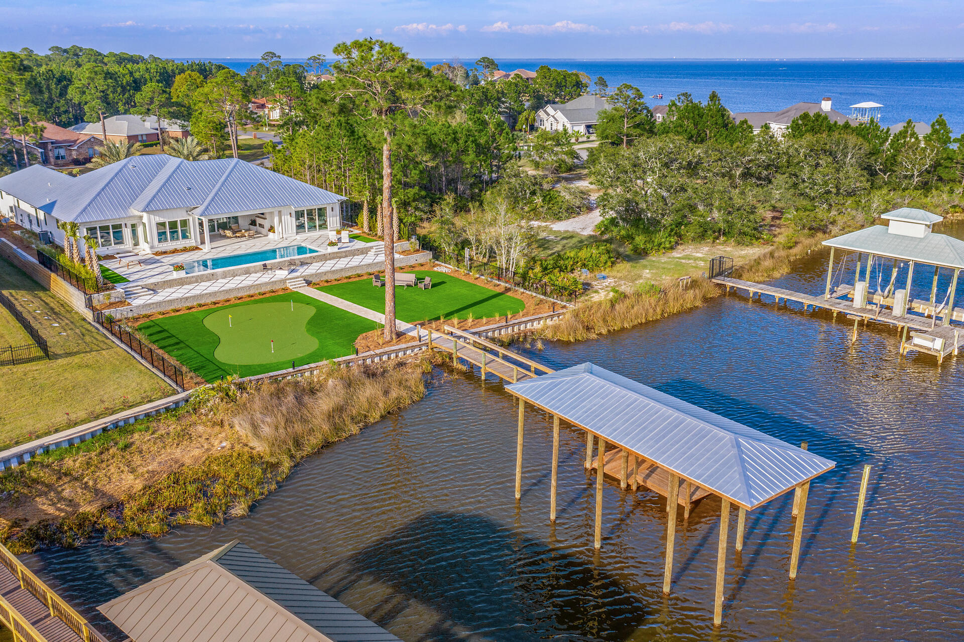 336 East Shipwreck Road Santa Rosa Beach, FL 32459 - Photo 16 of 73 an aerial view of a house with a swimming pool patio and mountain view