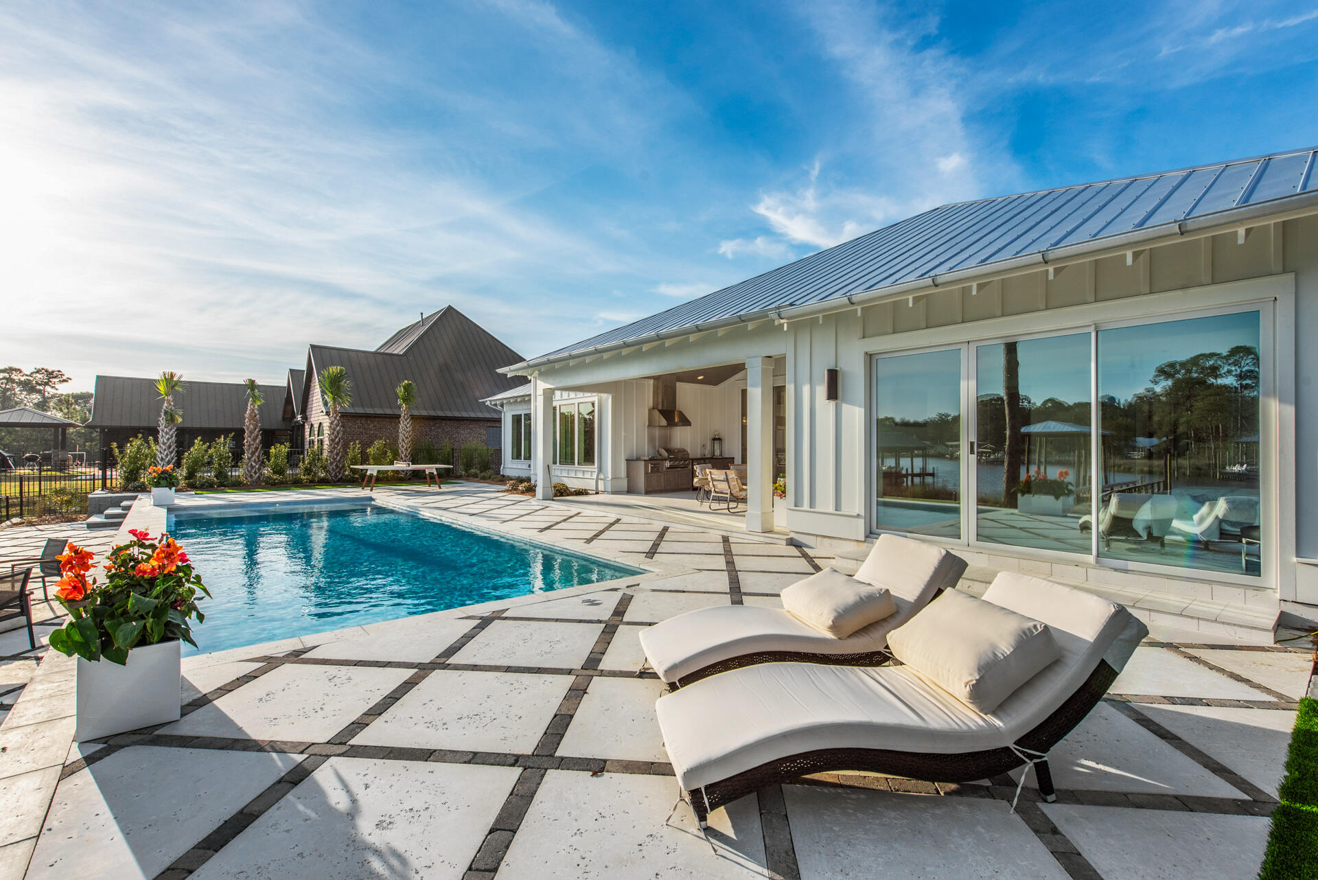 336 East Shipwreck Road Santa Rosa Beach, FL 32459 - Photo 29 of 73 a view of a patio with couches table and chairs and potted plants