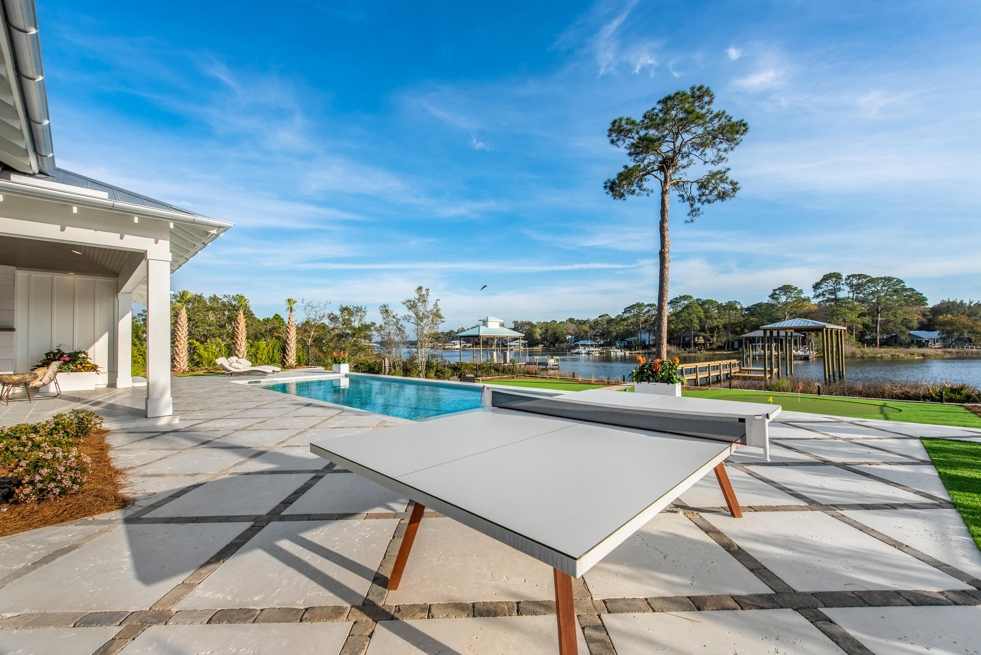 336 East Shipwreck Road Santa Rosa Beach, FL 32459 - Photo 34 of 73 a view of a patio with a table and chairs