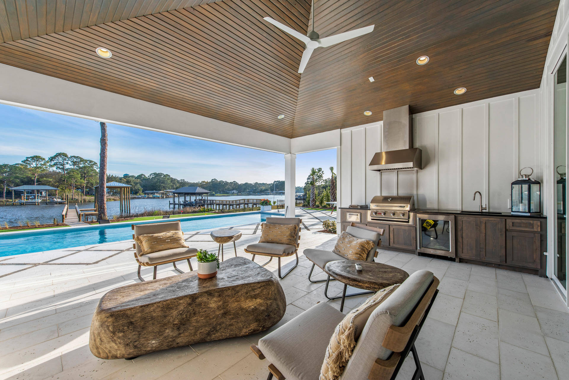 336 East Shipwreck Road Santa Rosa Beach, FL 32459 - Photo 38 of 73 a living room with patio furniture and a floor to ceiling window