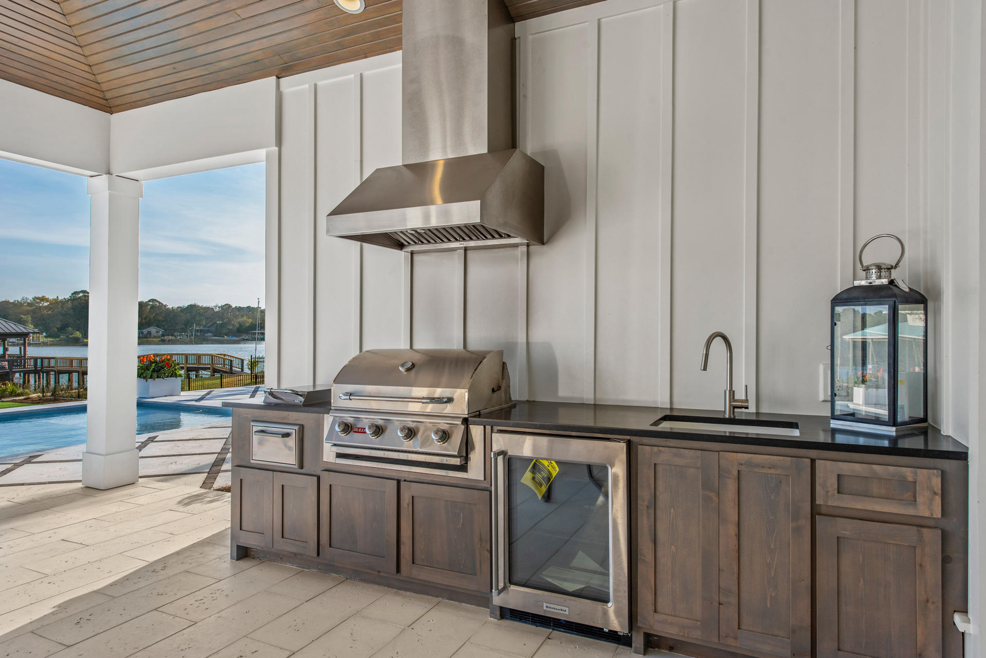336 East Shipwreck Road Santa Rosa Beach, FL 32459 - Photo 39 of 73 a kitchen with stainless steel appliances granite countertop a stove a sink and a microwave