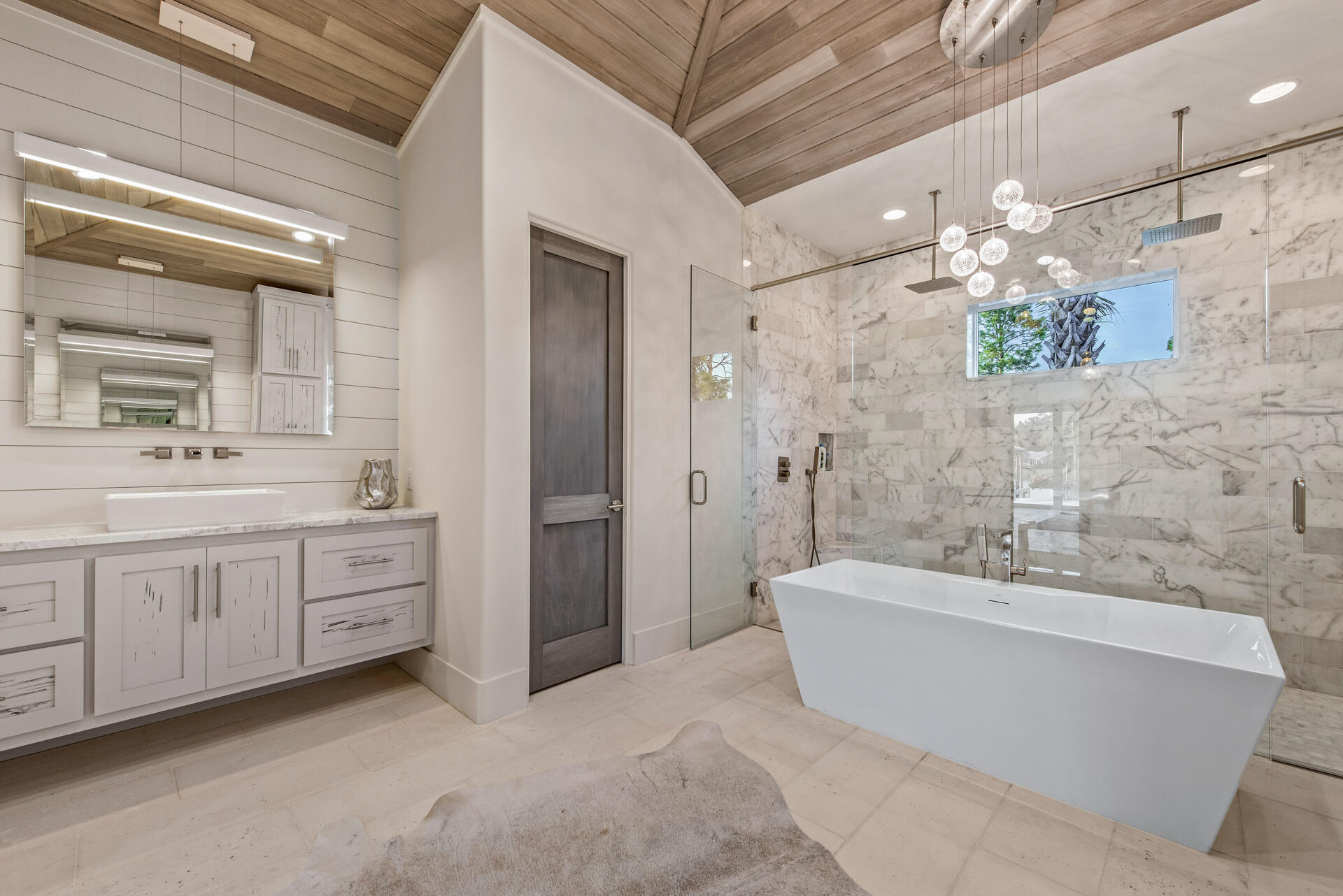 336 East Shipwreck Road Santa Rosa Beach, FL 32459 - Photo 49 of 73 a bathroom with a double vanity sink mirror and a bathtub
