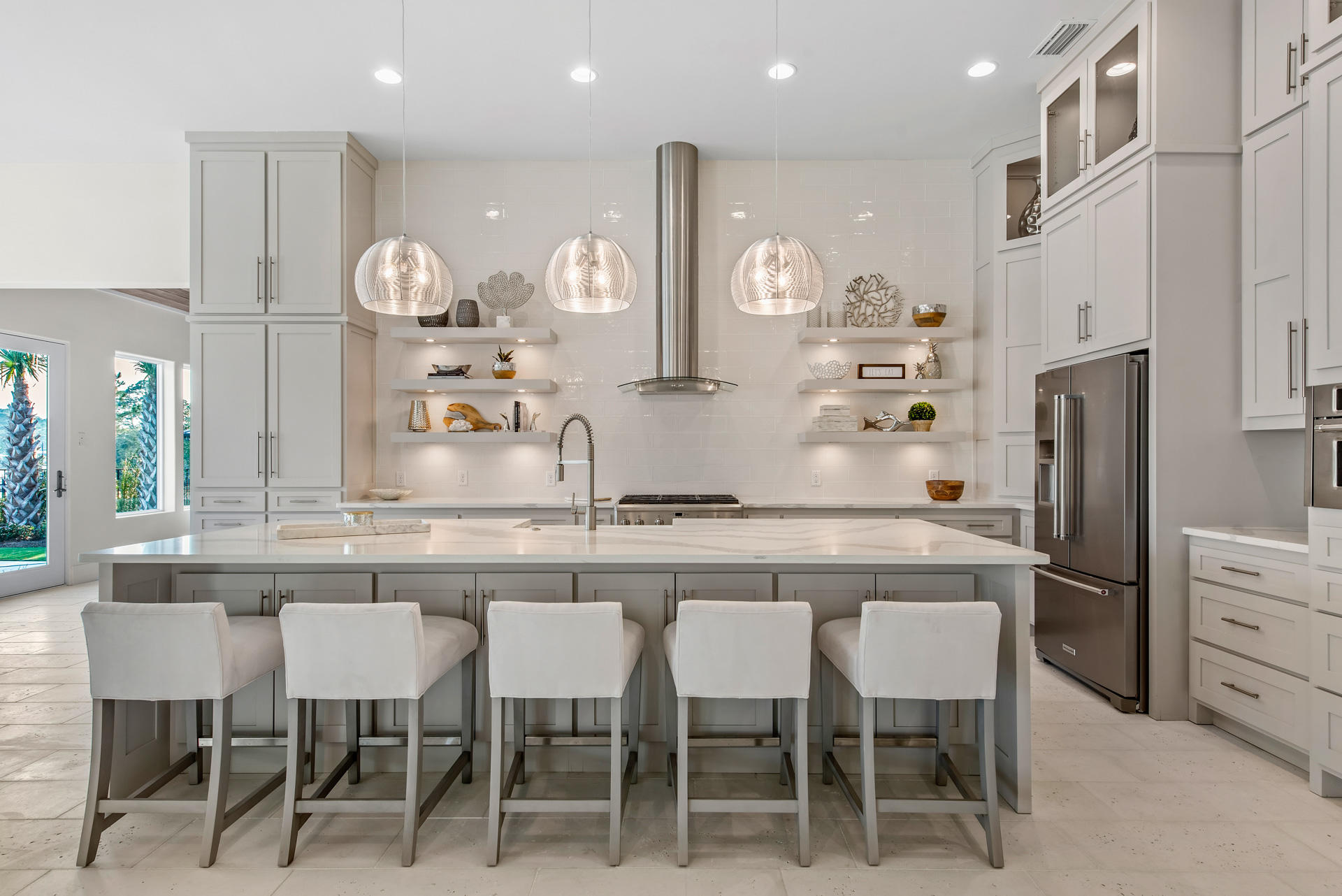 336 East Shipwreck Road Santa Rosa Beach, FL 32459 - Photo 56 of 73 a kitchen with stainless steel appliances granite countertop table chairs sink and cabinets