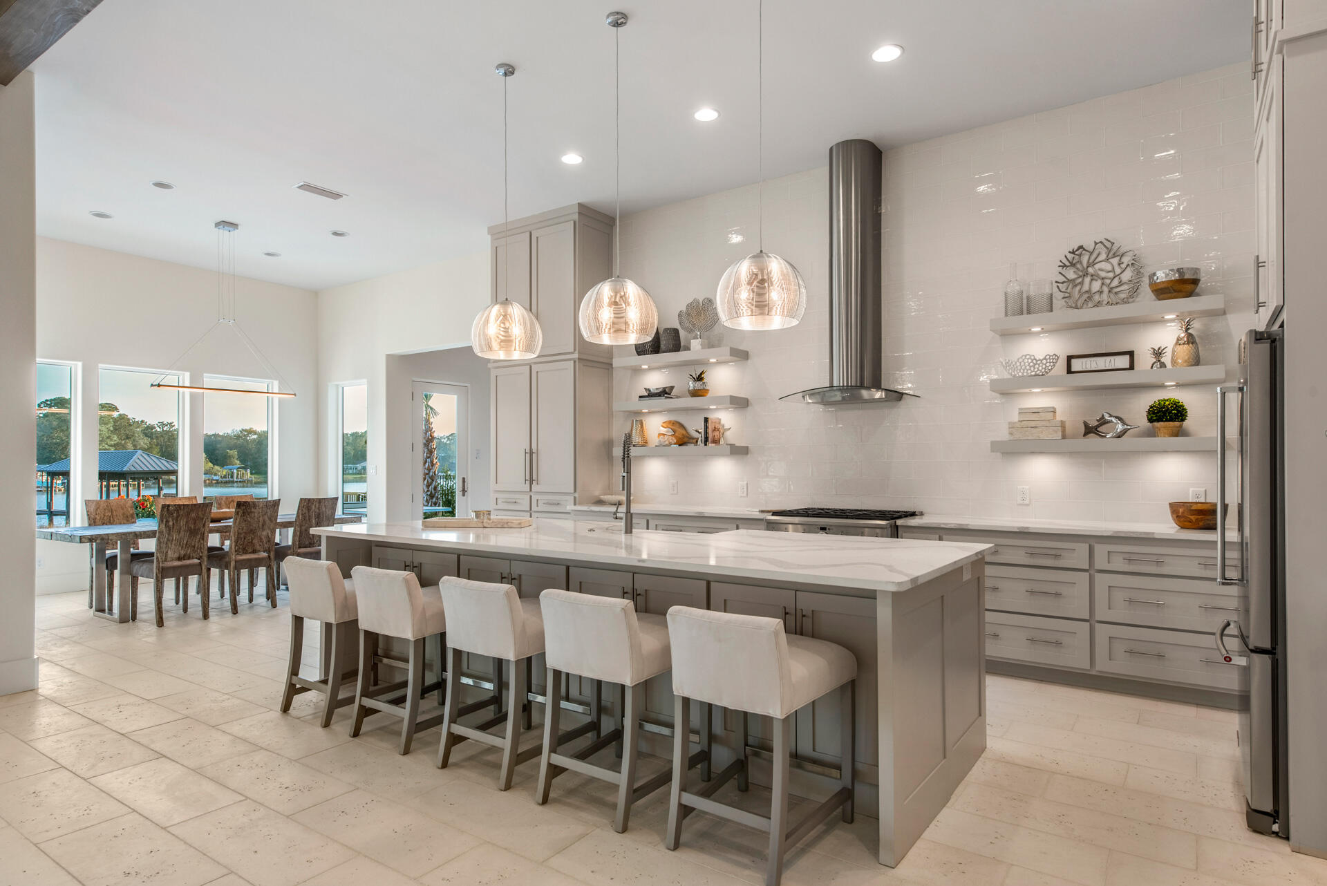 336 East Shipwreck Road Santa Rosa Beach, FL 32459 - Photo 58 of 73 a kitchen with kitchen island granite countertop a table and chairs in it