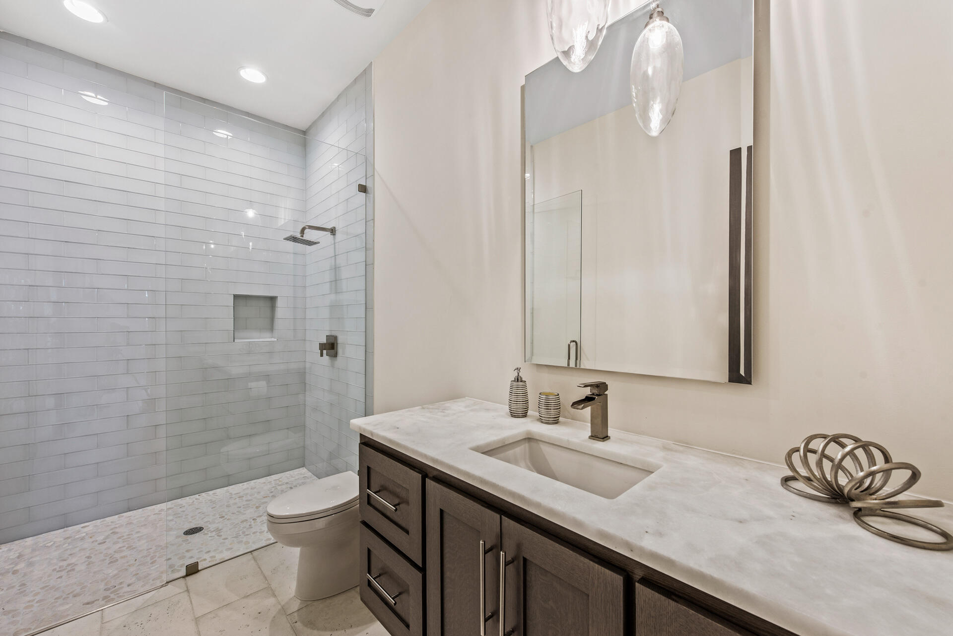 336 East Shipwreck Road Santa Rosa Beach, FL 32459 - Photo 66 of 73 a bathroom with a granite countertop sink a toilet a mirror and shower