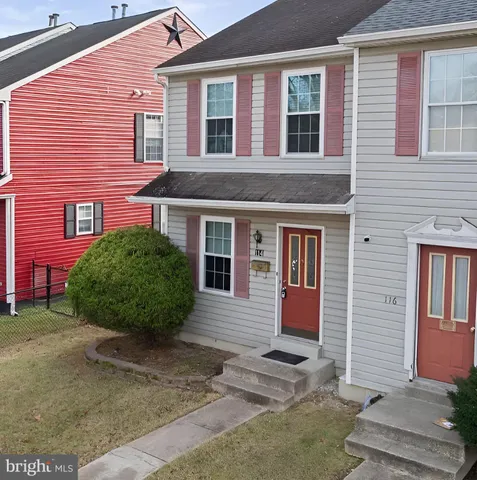 a view of a brick building with many windows