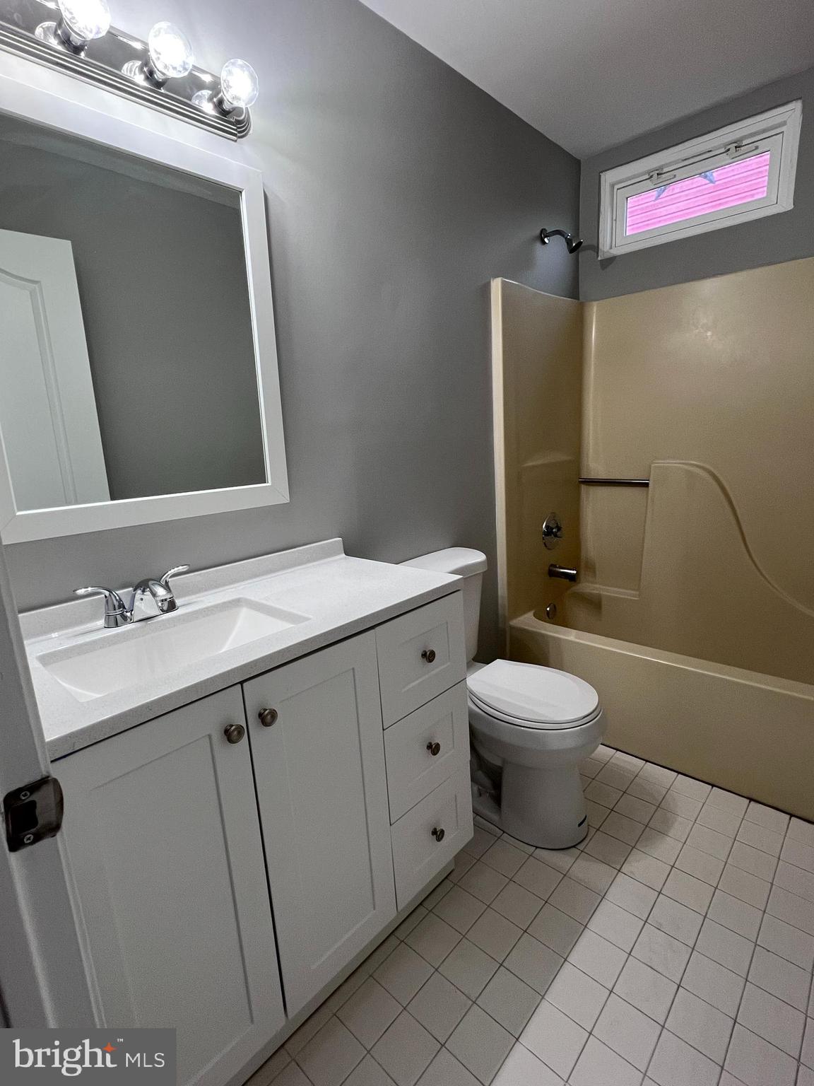 114 Gloucester Avenue Lawnside, NJ 08045 - Photo 15 of 22 a bathroom with a toilet sink and mirror