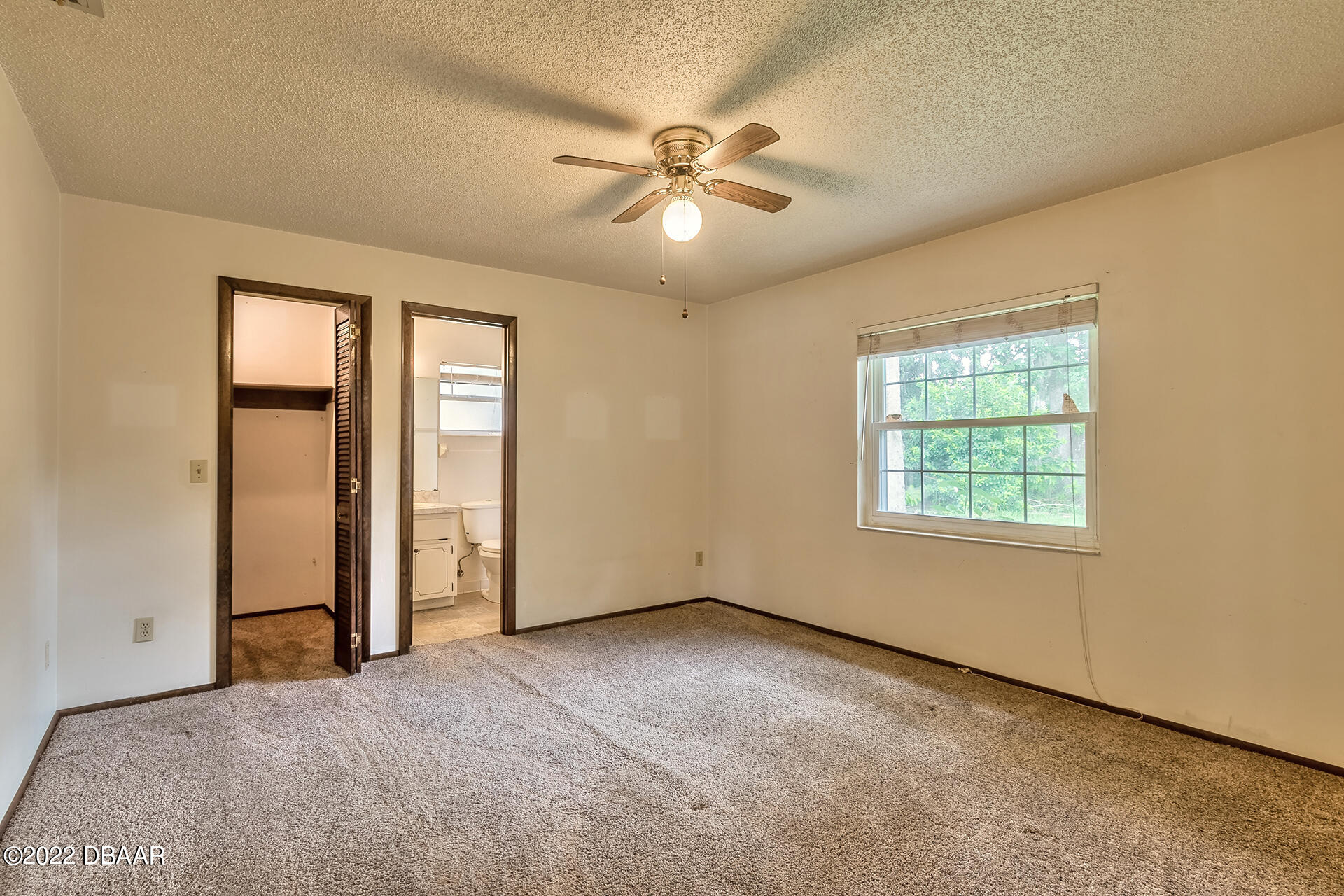 8 Greenfern Circle Ormond Beach, FL 32174 - Photo 14 of 25 an empty room with windows and fan