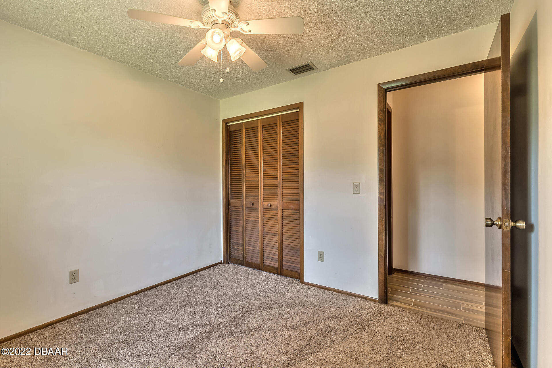 8 Greenfern Circle Ormond Beach, FL 32174 - Photo 19 of 25 an empty room with windows and closet