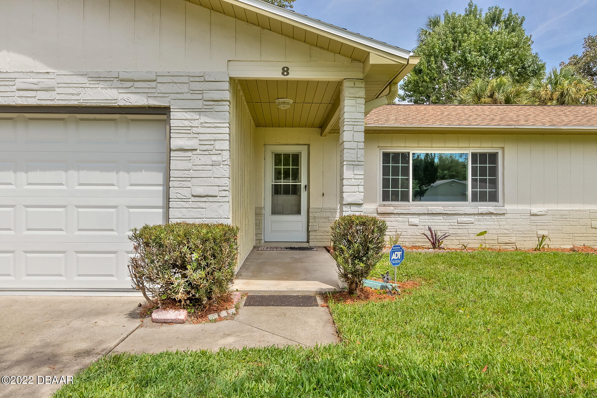 8 Greenfern Circle Ormond Beach, FL 32174 - Photo 4 of 25 a front view of a house with garden