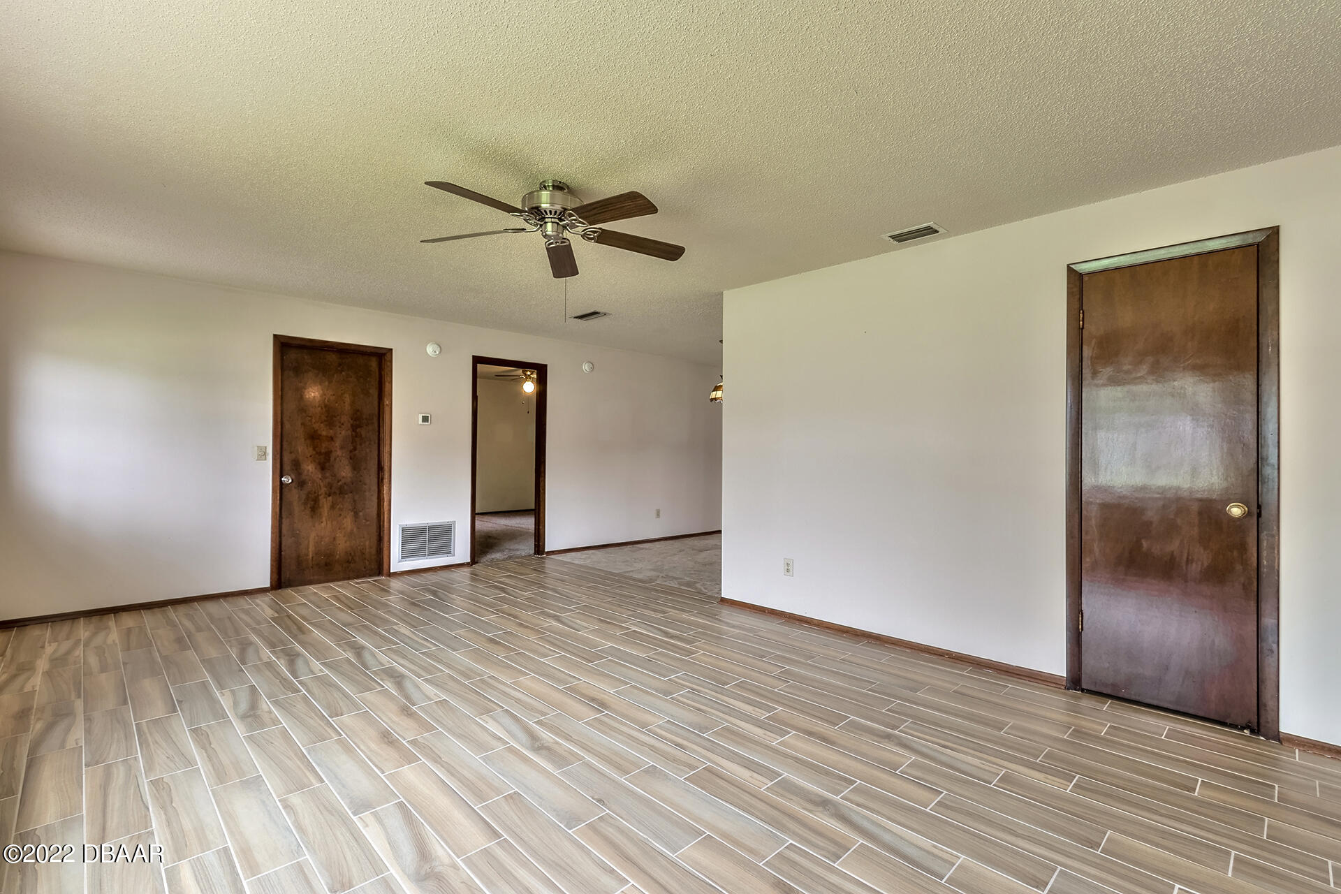 8 Greenfern Circle Ormond Beach, FL 32174 - Photo 7 of 25 a view of empty room with wooden floor
