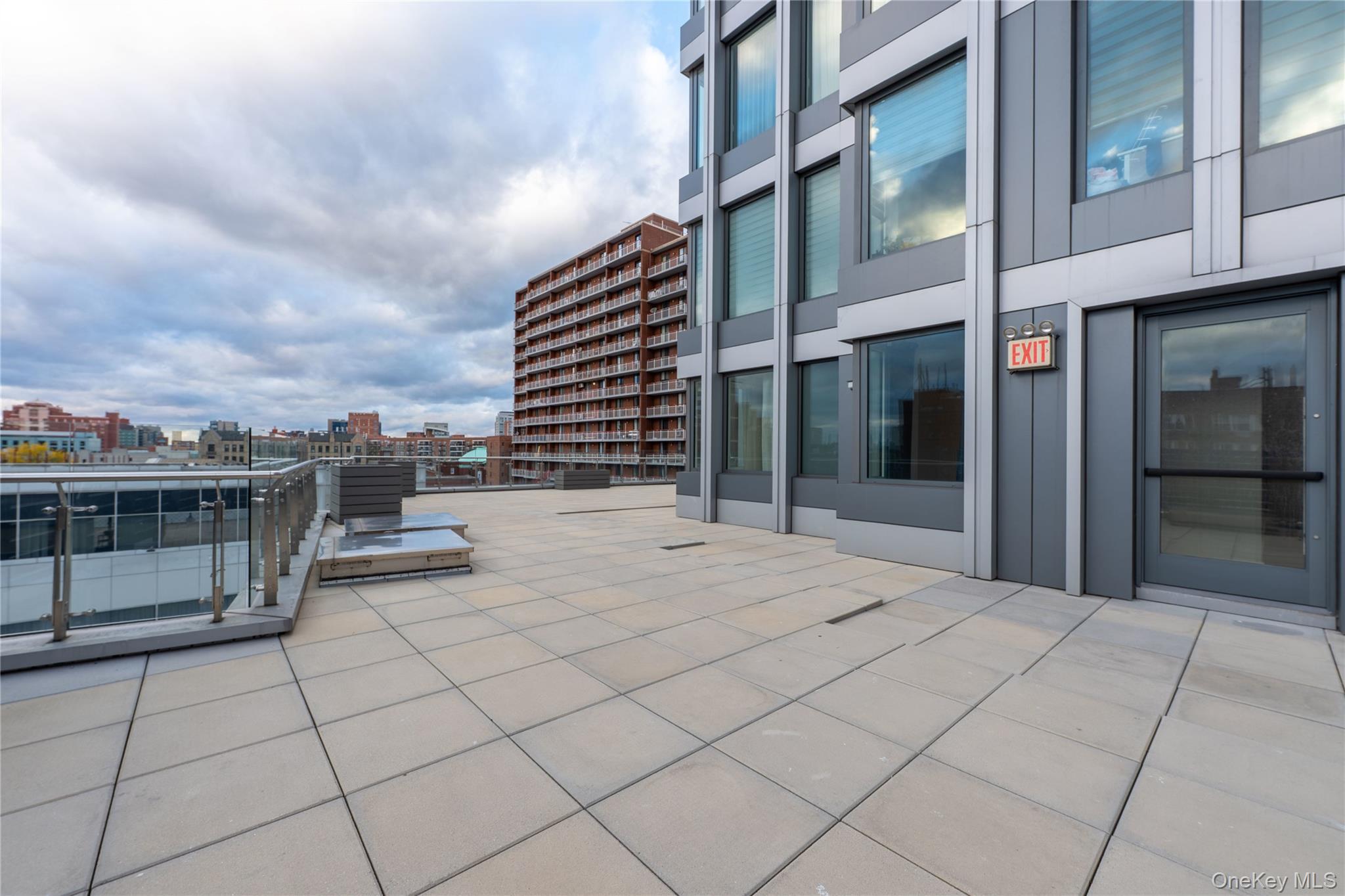 13618 Maple Avenue, Unit 5F Queens, NY 11355 - Photo 21 of 41 View of patio featuring a city view