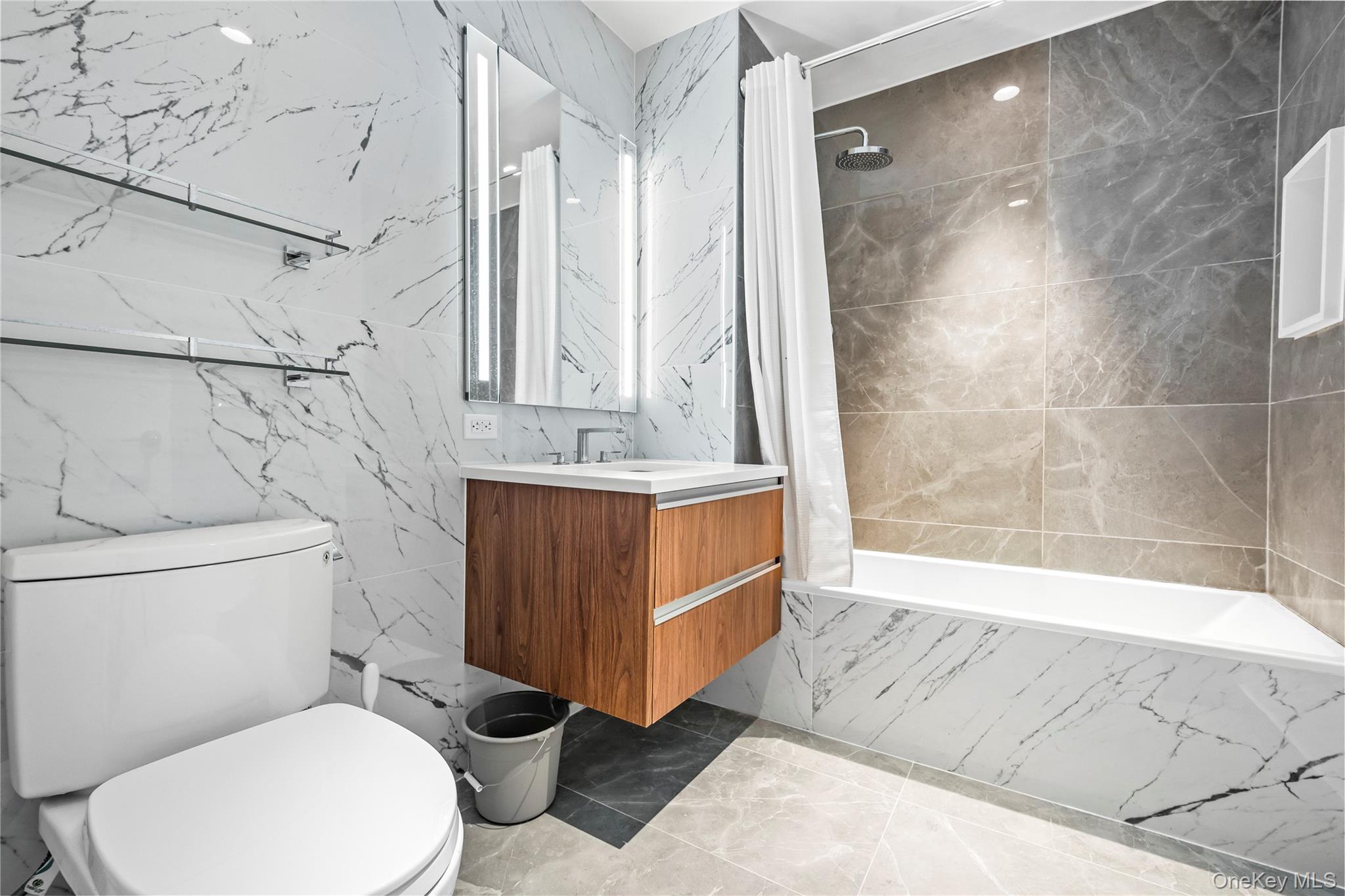 13618 Maple Avenue, Unit 5F Queens, NY 11355 - Photo 35 of 41 Full bath featuring vanity, tiled shower / bath, tile walls, and light marble finish flooring