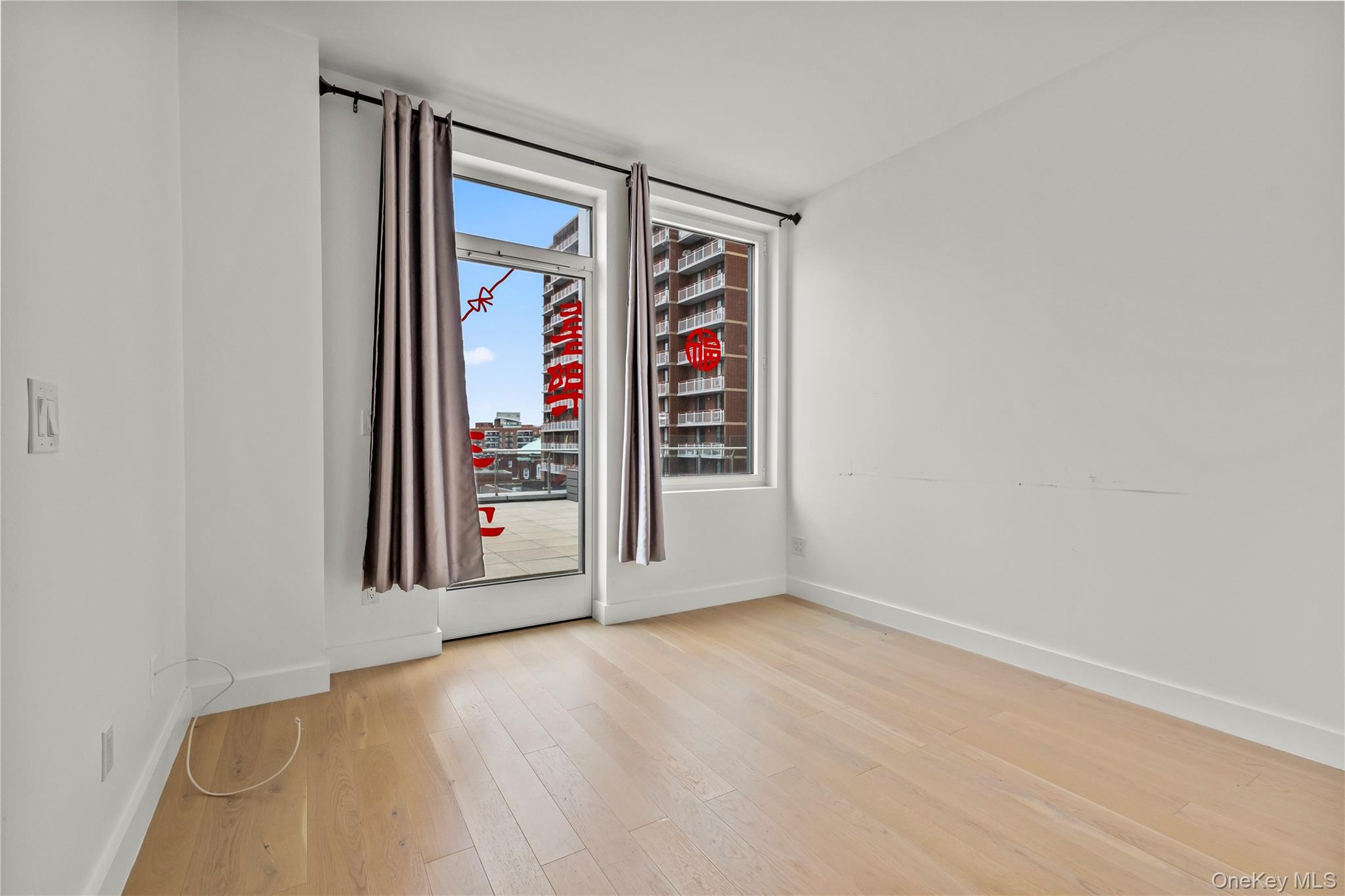 13618 Maple Avenue, Unit 5F Queens, NY 11355 - Photo 6 of 41 Spare room with baseboards and light wood finished floors