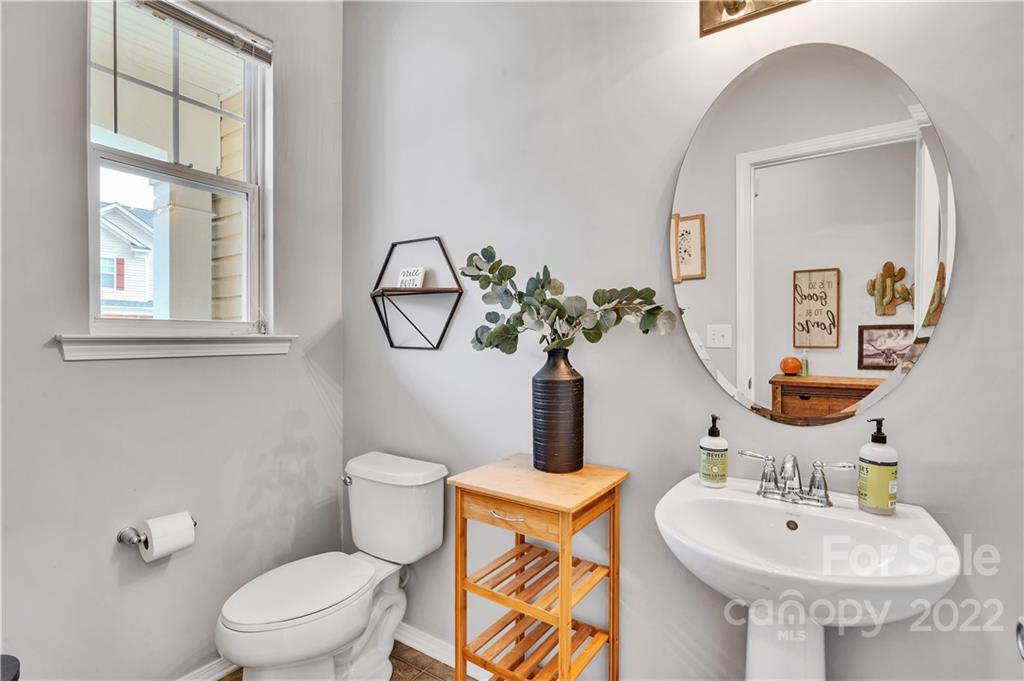 283 River Clay Road Fort Mill, SC 29708 - Photo 3 of 22 a bathroom with a toilet sink and mirror