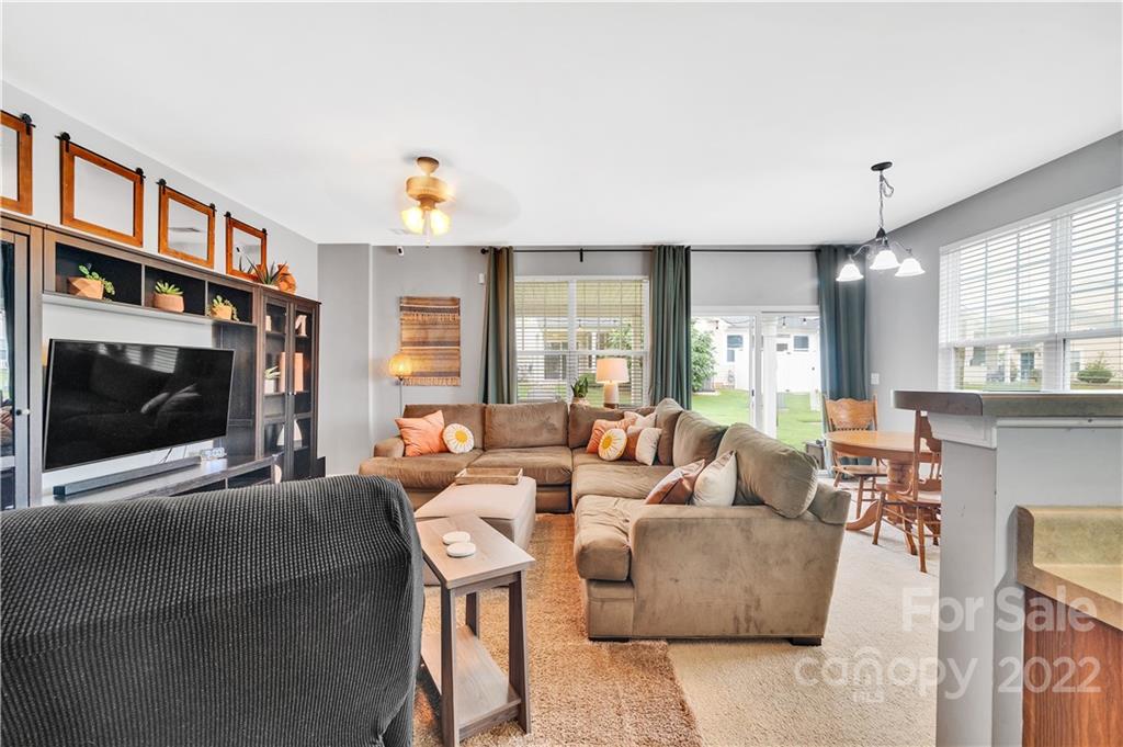 283 River Clay Road Fort Mill, SC 29708 - Photo 5 of 22 a living room with fireplace furniture and a flat screen tv