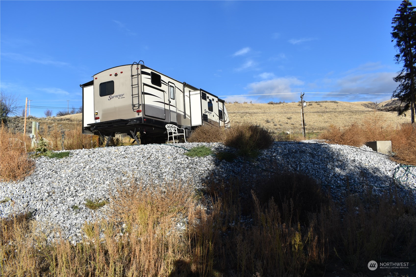 685 Loomis-Oroville Road Tonasket, WA 98855 - Photo 21 of 36 a front view of a house with a yard