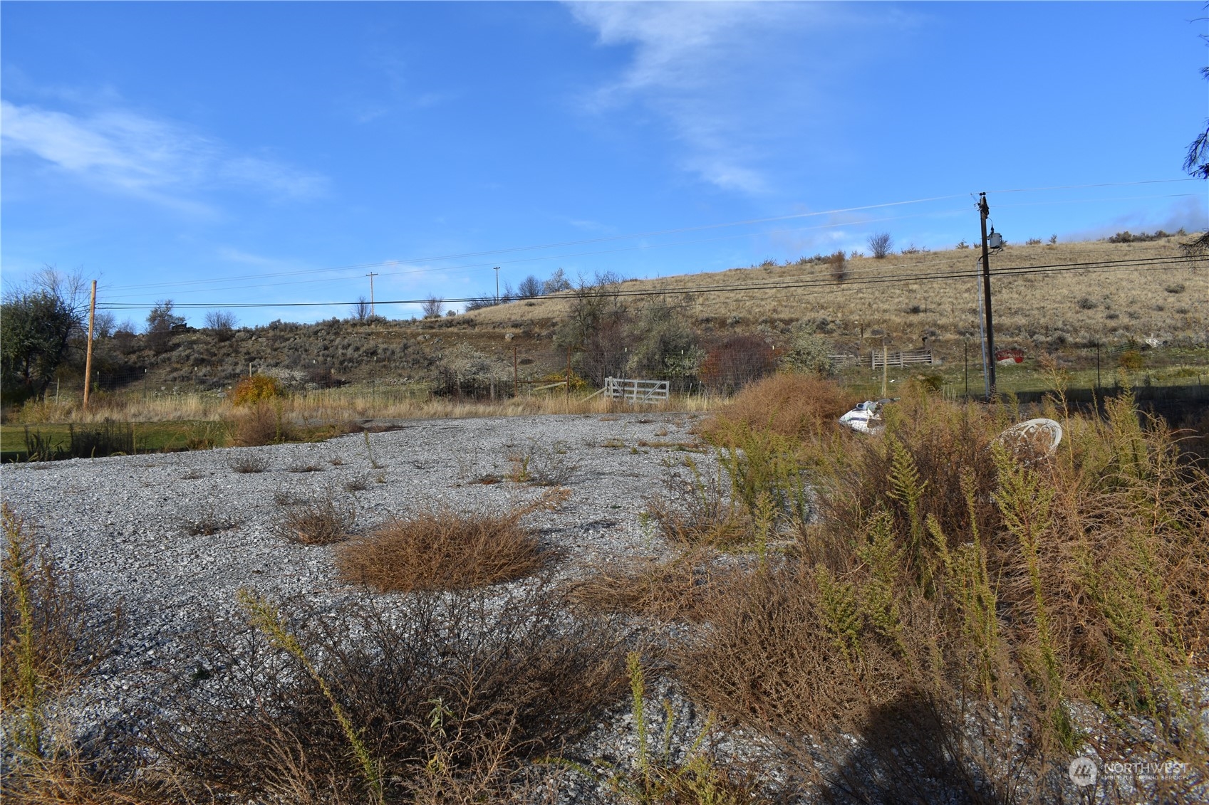 685 Loomis-Oroville Road Tonasket, WA 98855 - Photo 24 of 36 a view of a lake next to a mountain