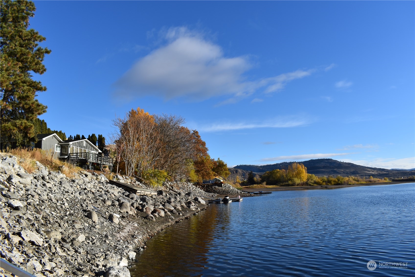 685 Loomis-Oroville Road Tonasket, WA 98855 - Photo 6 of 36 a view of a lake with a mountain in the background