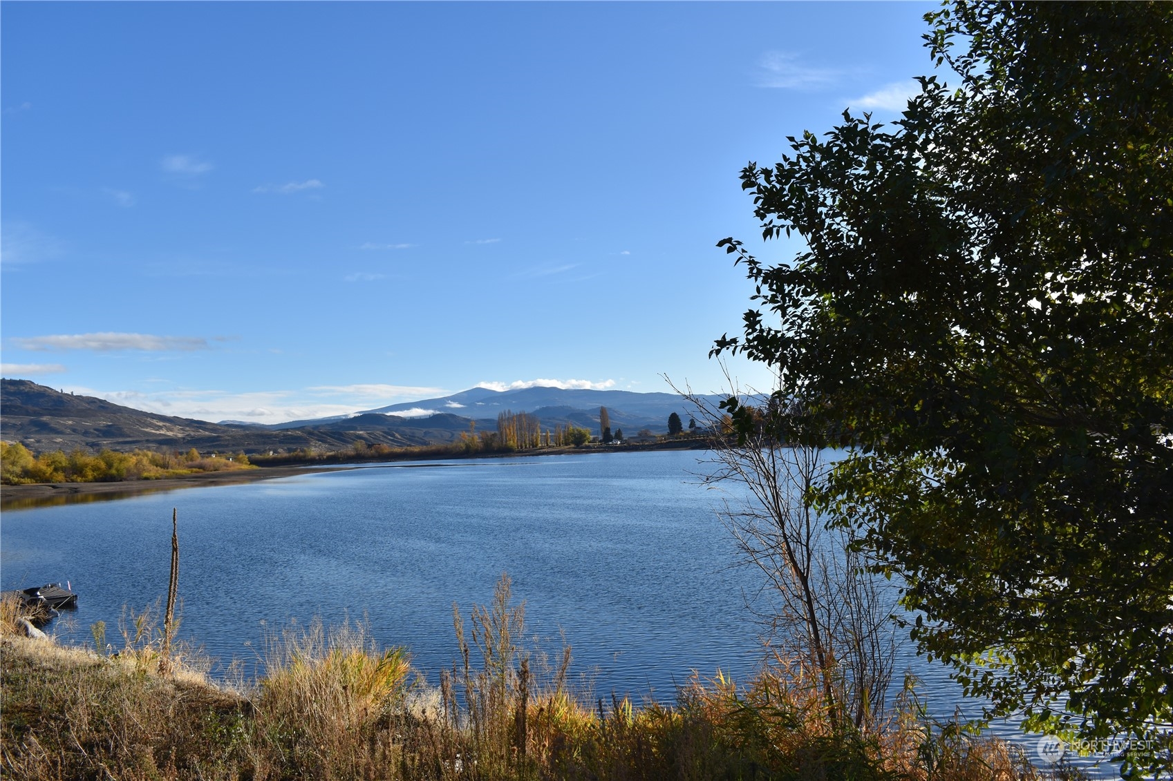 685 Loomis-Oroville Road Tonasket, WA 98855 - Photo 9 of 36 a view of a lake and mountain