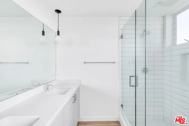 a bathroom with a sink and shower