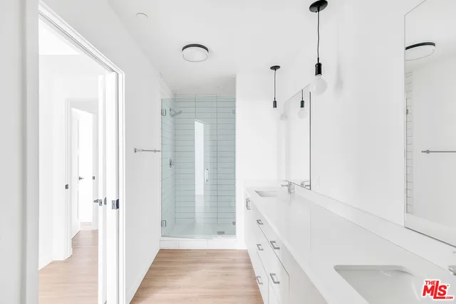 a bathroom with a tub sink and shower