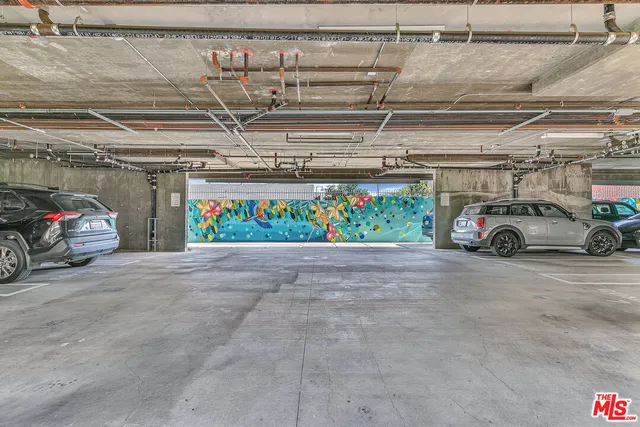 a view of parking garage with cars