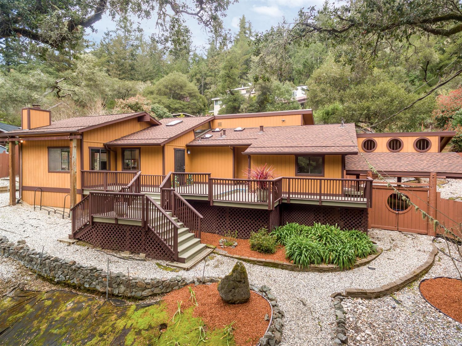 an aerial view of a house with swimming pool and furniture