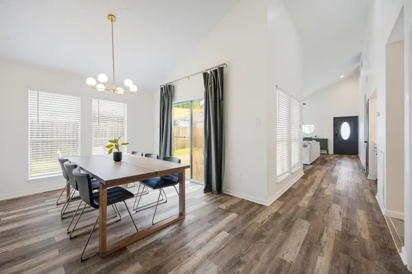 a view of a dining room with furniture and window
