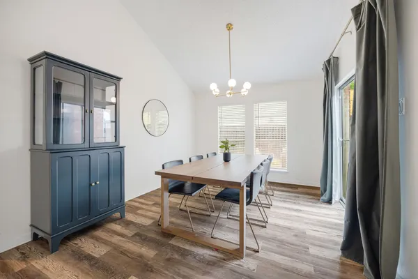 a view of a dining room with furniture window and wooden floor