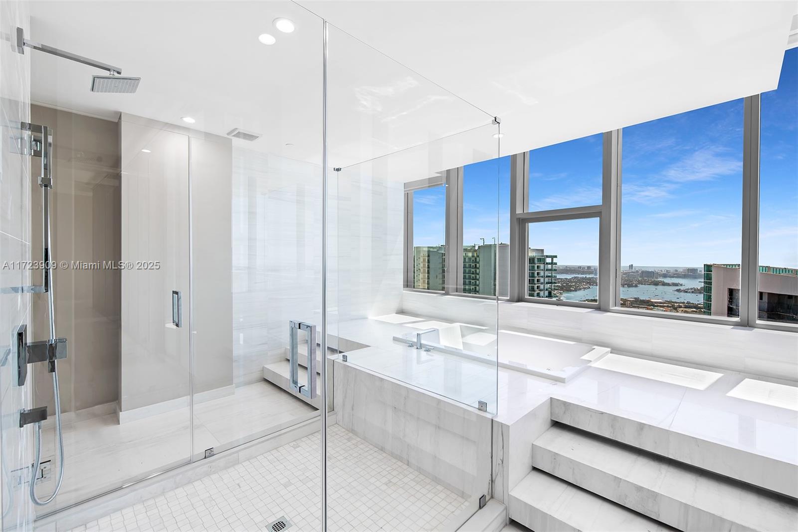 851 Northeast 1st Avenue, Unit PH5411 Miami, FL 33132 - Photo 16 of 40 a spacious bathroom with a large tub and shower